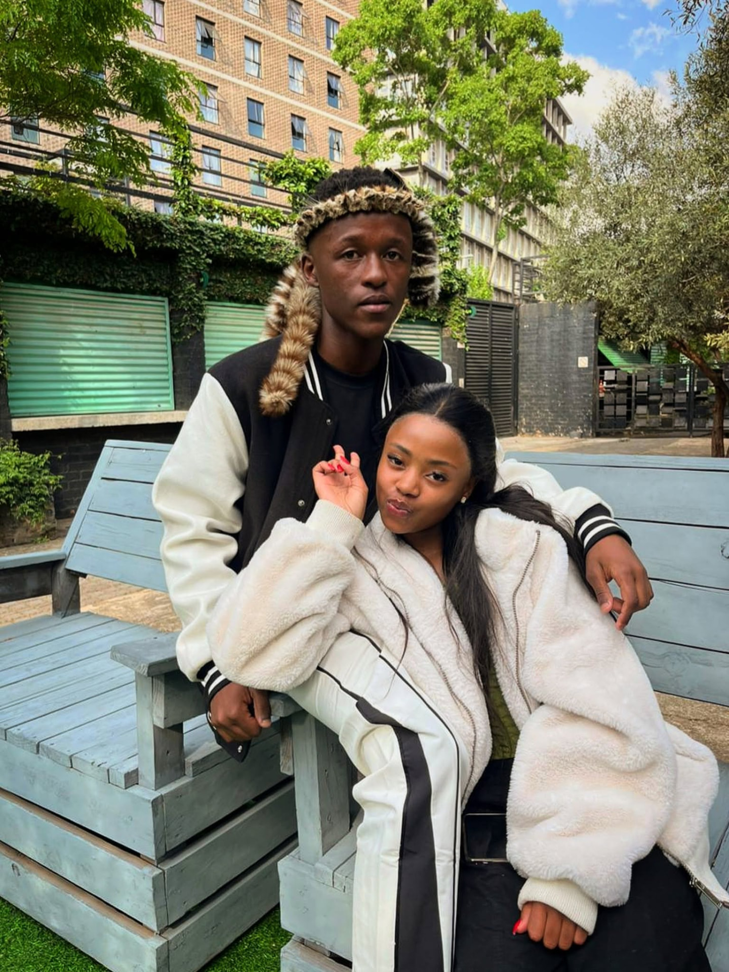 Sqiniseko SqinQ in a varsity jacket with a collaborator