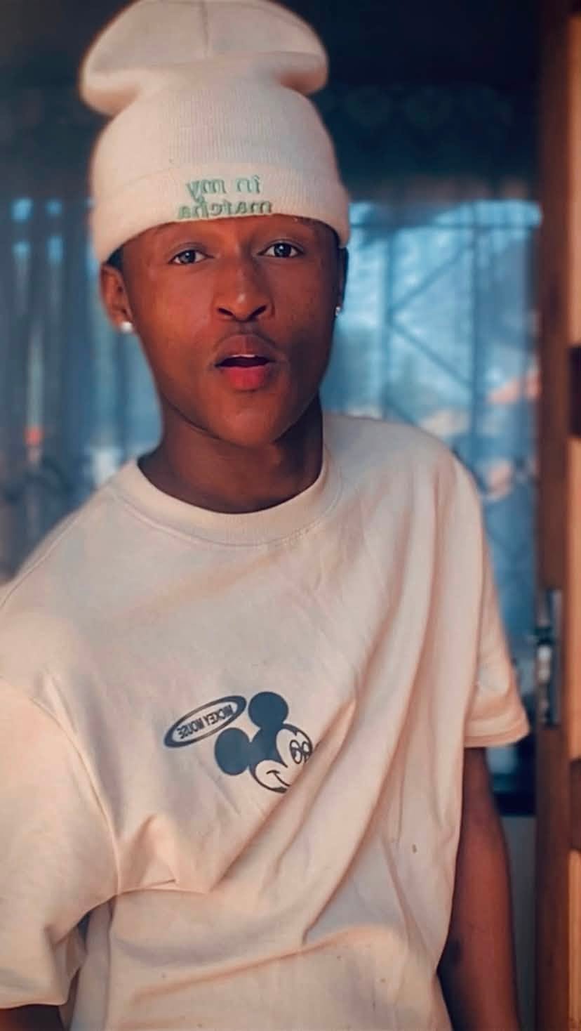 Sqiniseko SqinQ portrait in a cream beanie