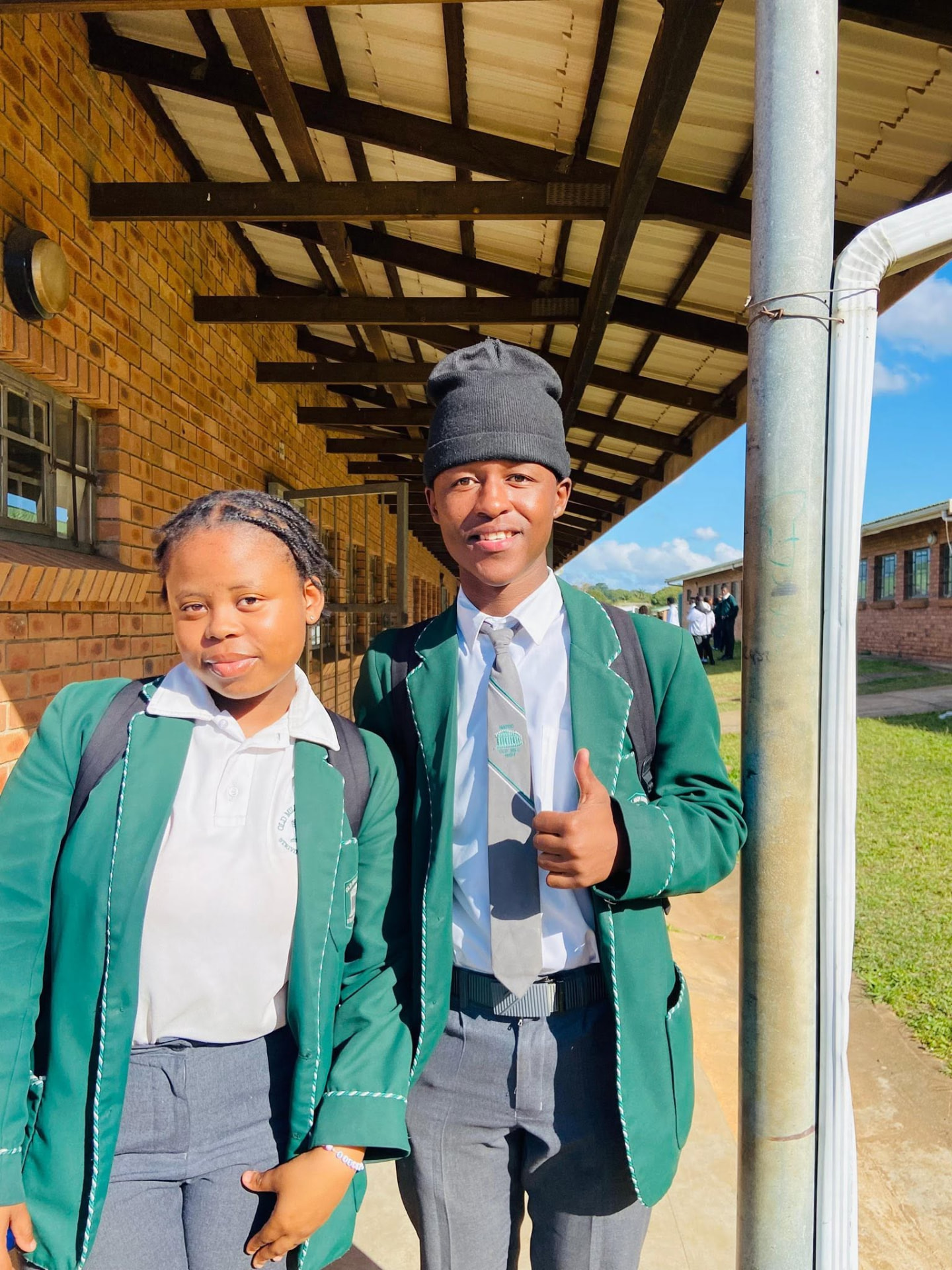 Sqiniseko SqinQ with learners in school uniform